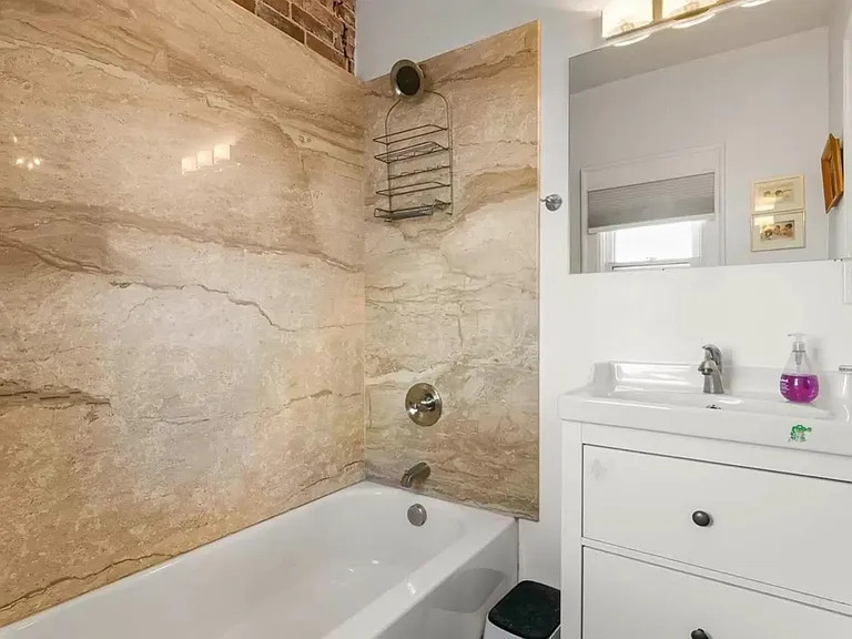 bathroom 1 with full slab solid surfaces & modern vanity
