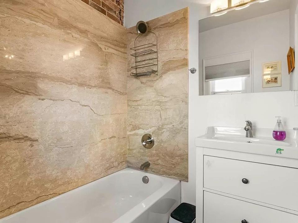 bathroom 1 with full slab solid surfaces & modern vanity