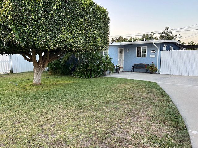 Large front yard and curving driveway