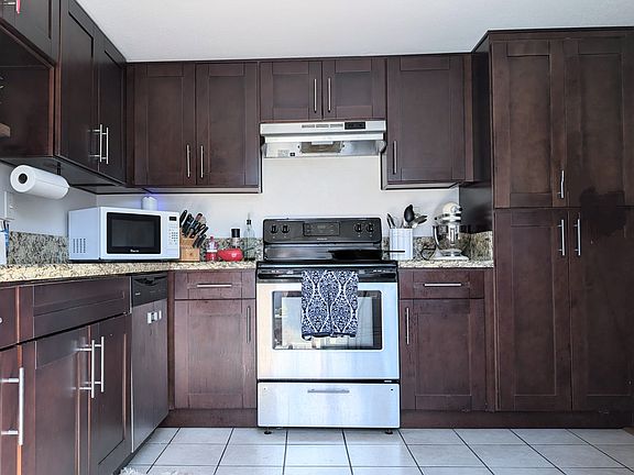 Updated cabinets and stainless kitchen steel appliances