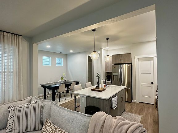 Open concept living, dining, and kitchen area