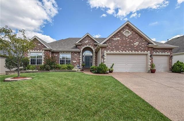 Stately brick and stone exterior with brick mailbox. Inside - garage is insulated with R-38 ceilings and R-11 walls and floors are epoxied