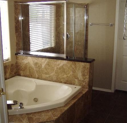 Corner Jacuzzi tub with Marble surround