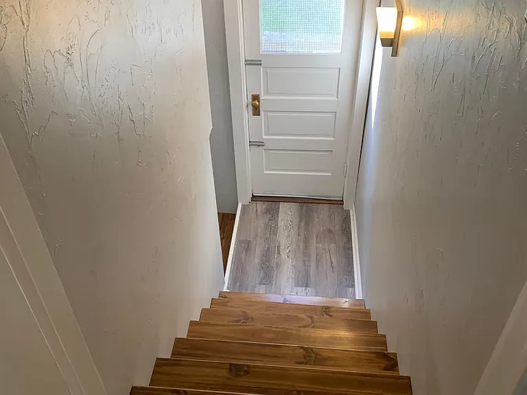 Stairway going to basement from just outside the kitchen