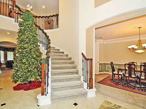 With high ceilings, the entry welcomes into a spacious interior with open views of several rooms so the home feels light and open and great for time to be spent with family and friends.