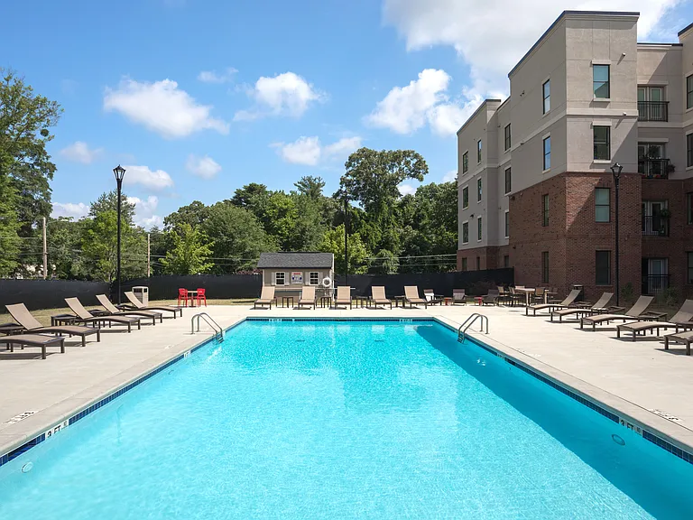 Resort-style swimming pool with sundeck.