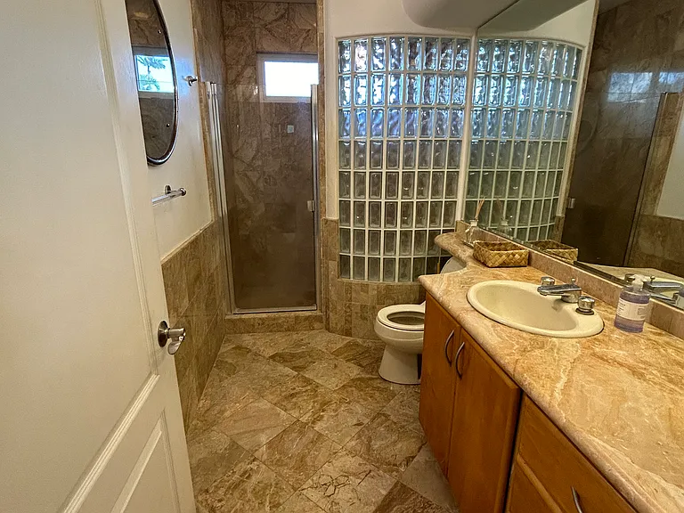 Third Full bathroom with Marble finishes located downstairs
