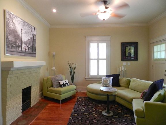 Parlor opens to formal living room though original pocket doors