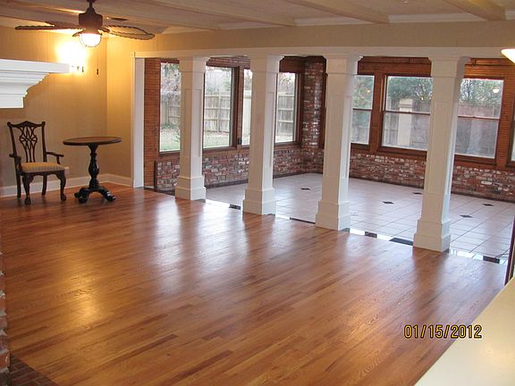 Den looking into sunroom [new Oak floor]