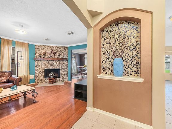 From the door way into the living room at left, with hallway towards kitchen at right side.