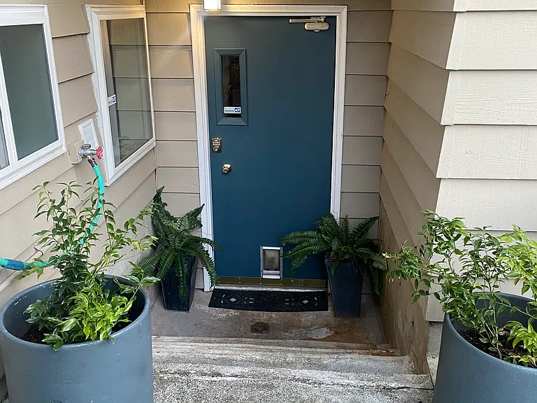Four steps down to the ground level rental.