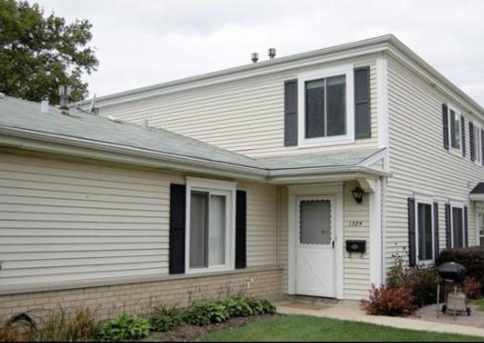 Private Entrance with Brick Patio and Garden