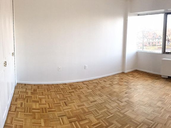 Large bedroom, with large closet & wall to wall window.