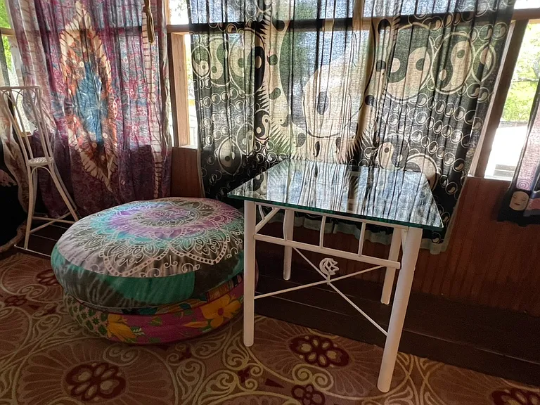 Boho cushion seating and side table. Patio.