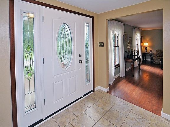 Spacious 13x9 Entry has updated fiberglass door with sidelights