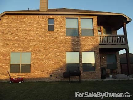 Back of house
						:
						Balcony is off of Master Bedroom