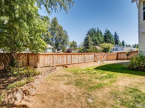 Large Corner Backyard with new fence except the gate that opens to park your RV or boat. Perfect Spot on side of Home. 