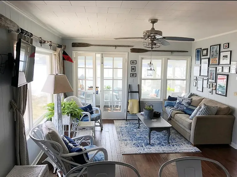 Living room with great natural lighting and a smart TV.