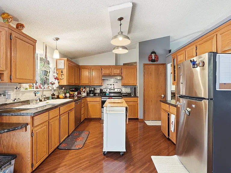 kitchen has pantry and stainless steel appliances