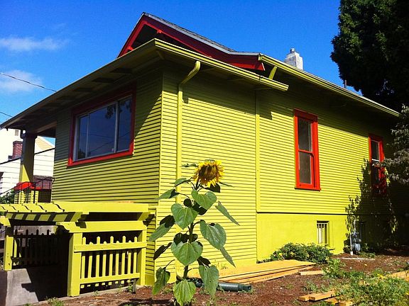 Side of house has three raised garden beds