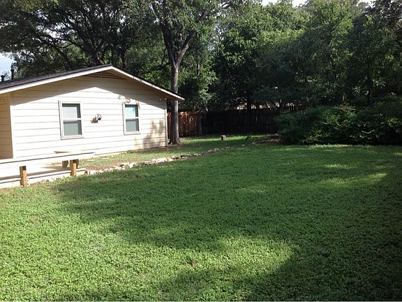 Large yard with privacy fence