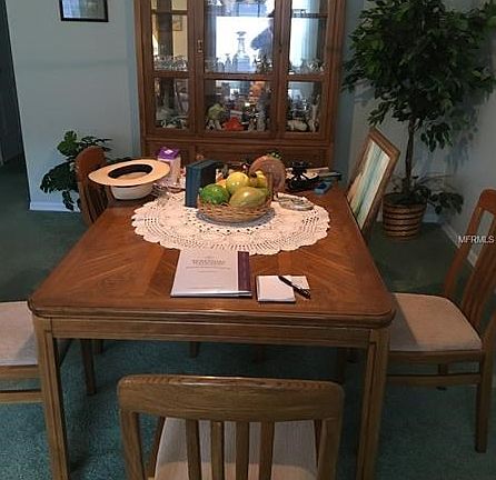 Dining room with hanging light.
