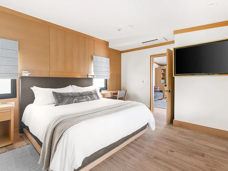 Luxurious linens and our favorite down comforter on the suites King sized bed