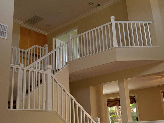 Open floor plan to upstairs with vaulted ceiling