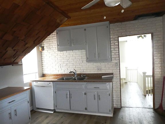 Kitchen looking toward sink and stair area