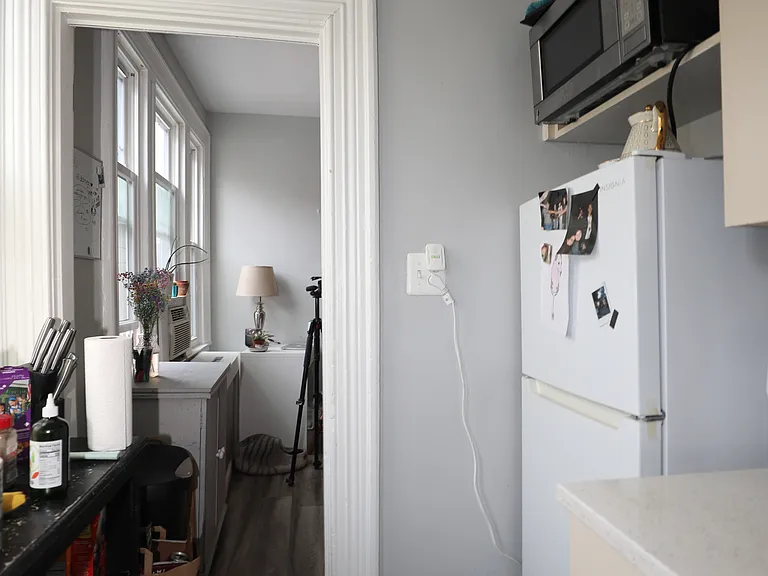 Kitchen with cabinet storage and essential appliances
