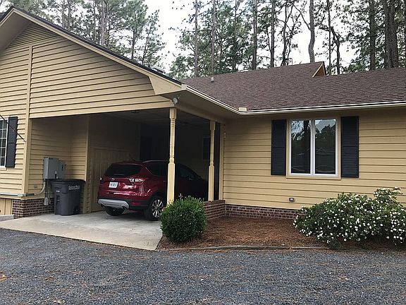 Carport w/ workshop on right