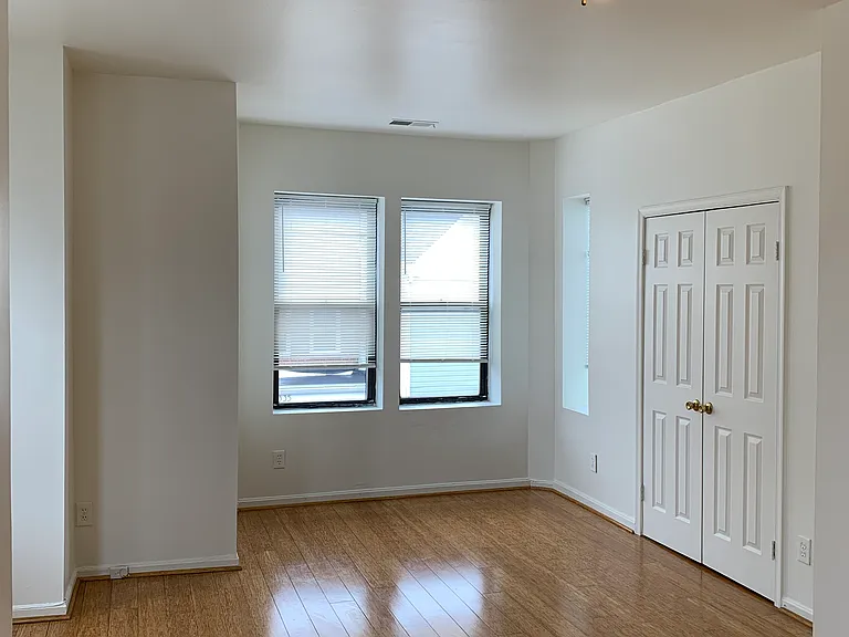 Livingroom with large closet. Lots of natural light.