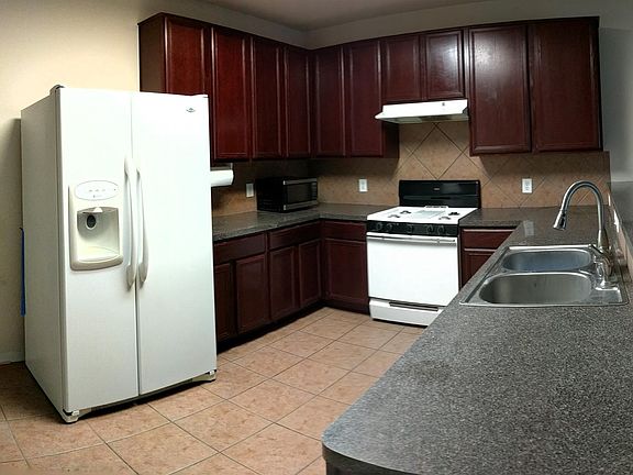 Beautiful and tall cabinets in a spacious kitchen