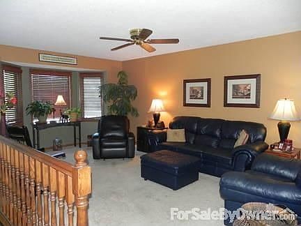 Upstairs livingroom with baywindow. Front entry with parque wood floor.
