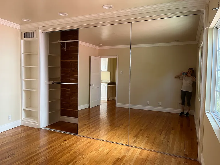 TRIPLE MIRRORED CLOSET W/ BUILT-INS AND BUILT-IN BOOKCASE