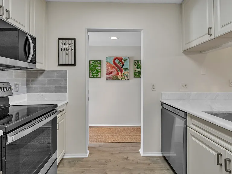 Beautifully upgraded kitchen w/ stainless steel appliances & pantry