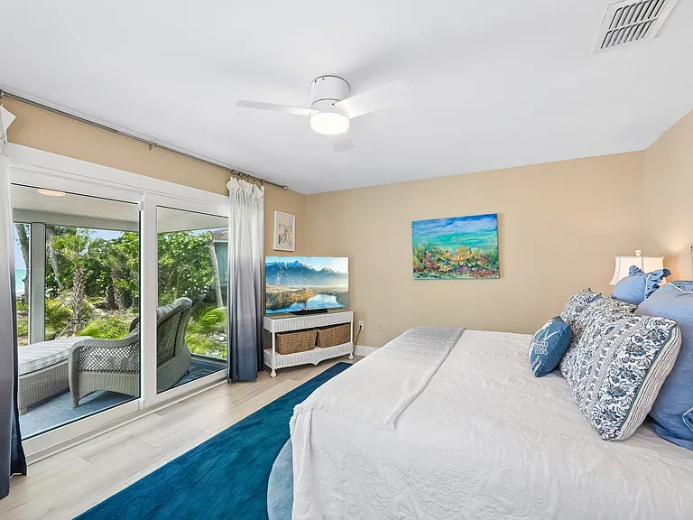 Primary bedroom/king bed with balcony and a view