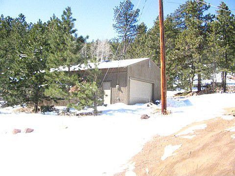 Huge 4 car detached garage with power and skylights!