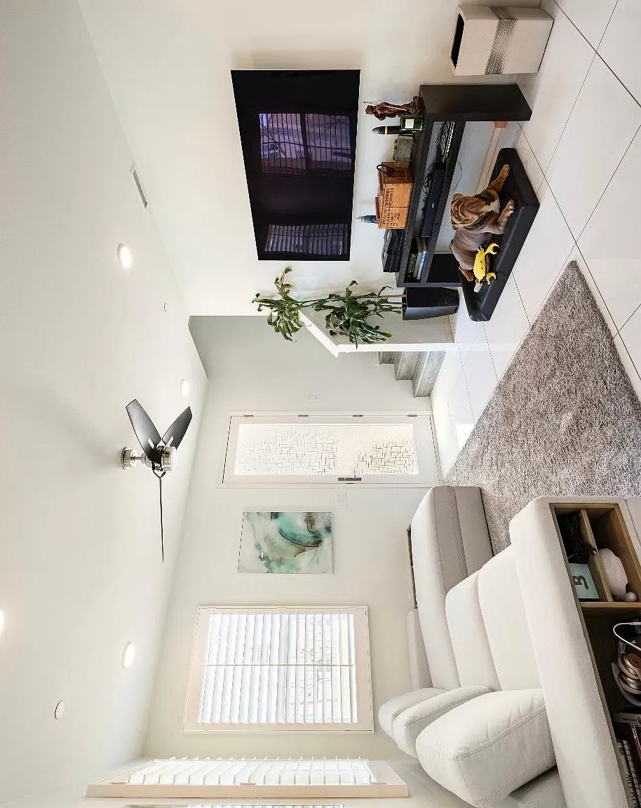 First floor living room/common space with patio, kitchen, & dining room all on one level