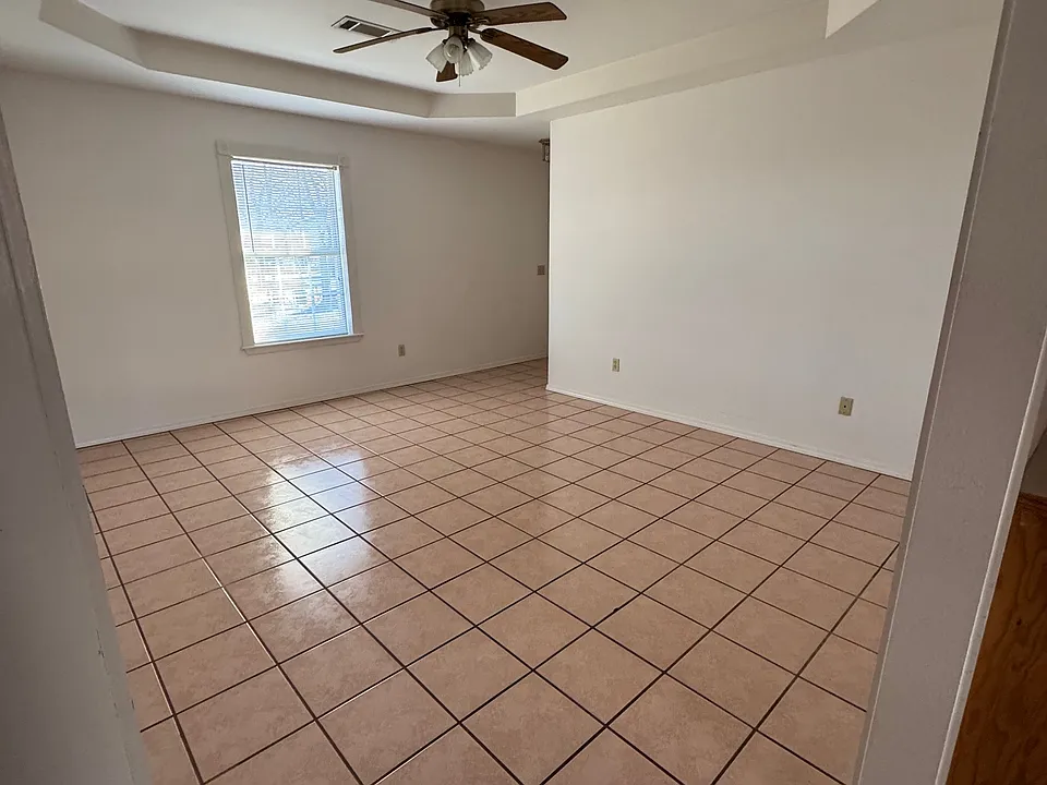 Living room with front door access to the porch