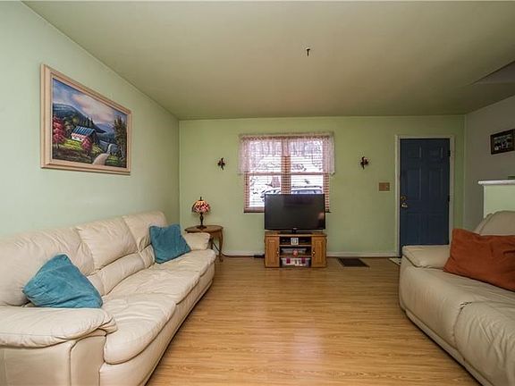 The front window allows natural line to shine into the living room.