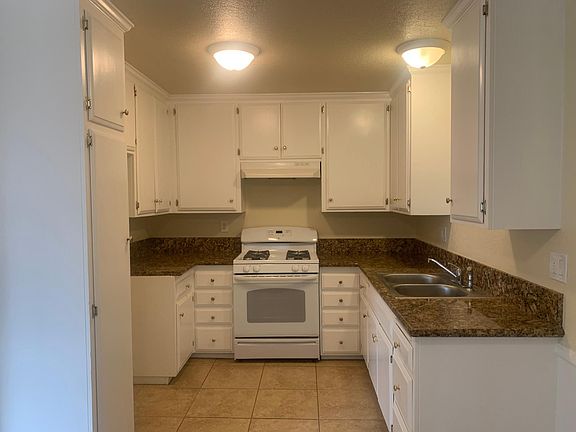 Remodeled kitchen. Granite counter tops and lots of cabinets.
