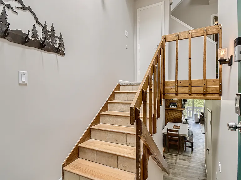 view with front door open (see green door)- split level entry. Note: lots of stairs to get to condo