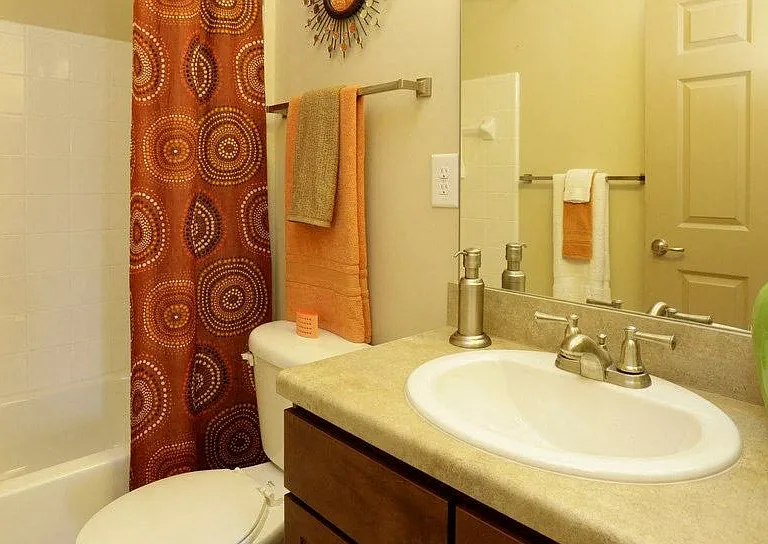 Spacious bathroom with cabinet space for convenient storage