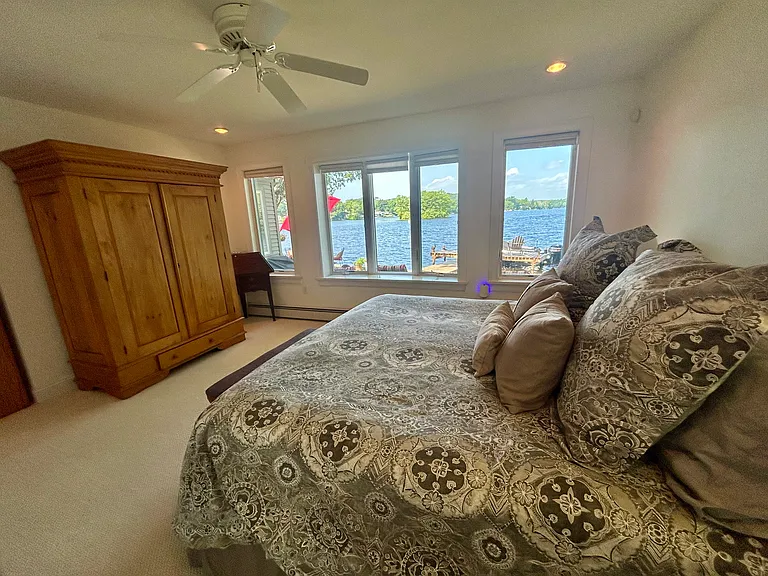 Primary Bedroom on ground floor with lake views. California King bed.