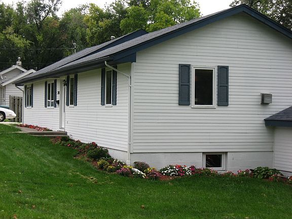 Front corner w flower beds