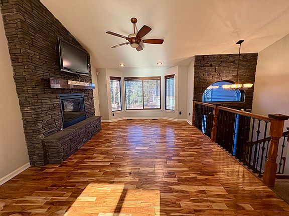 Living room with electric fireplace and stonewall accents
