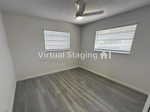 Bedroom One - window blinds, new floors, lighting and closet updates