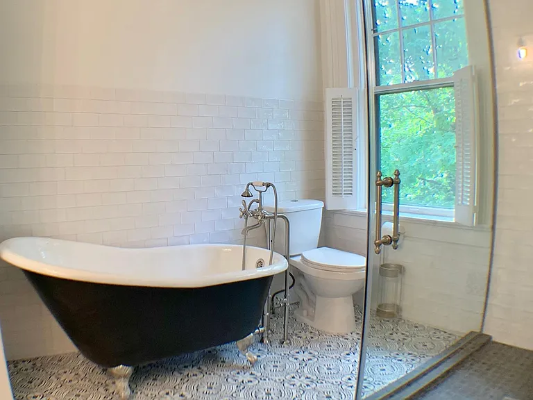 Master bathroom. Freestanding clawfoot tub rainfall shower head