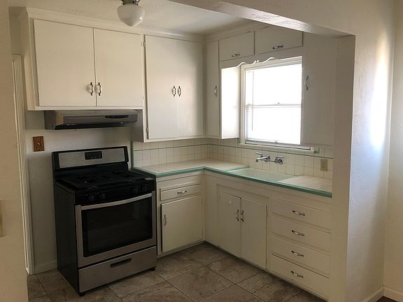 Kitchen (remodeled kitchen in unit A has new cabinets with granite counter top).